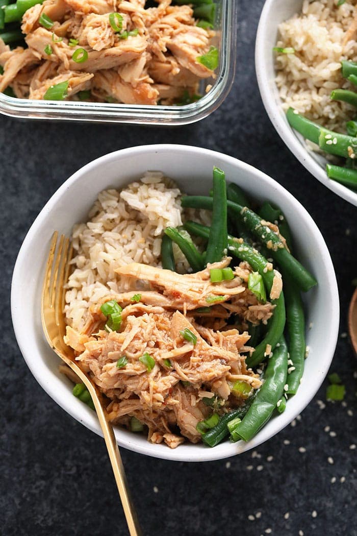 Our Crock Pot Honey Garlic Chicken is perfect for any weeknight meal, is kid-friendly, and made with only 5 ingredients! So? Make your grocery list, head to the store, and cook up this amazing slow cooker honey garlic chicken. Honey garlic chicken in a bowl served over brown rice and green beans.
